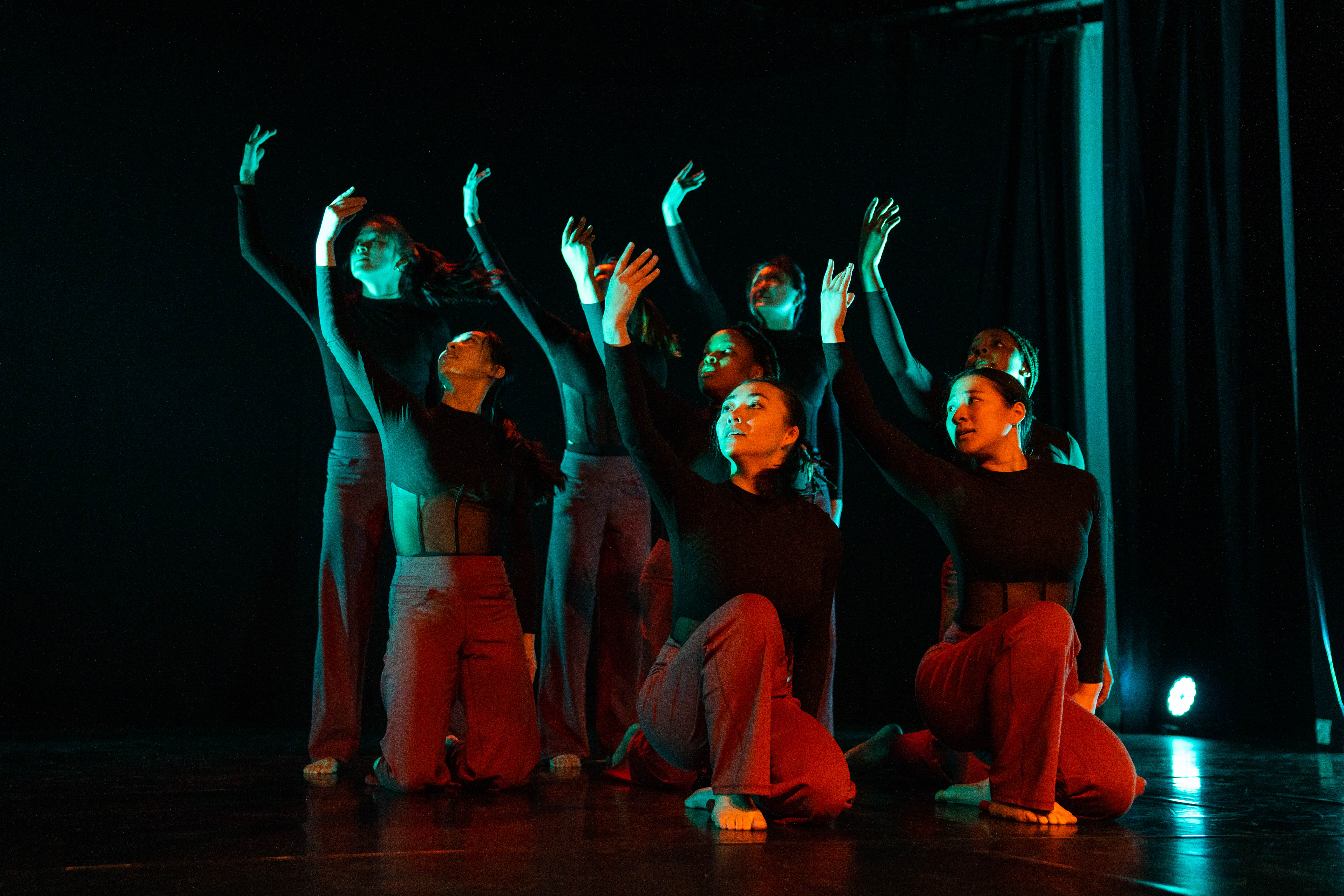 dancers in teal and red
